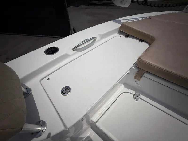 Slide: The Image of 2020 Sportsman Masters 247 Bay Boat interior with seating and storage compartments. - 40