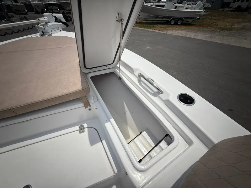 Slide: The Image of 2020 Sportsman Masters 247 Bay Boat storage compartment open on deck. - 43