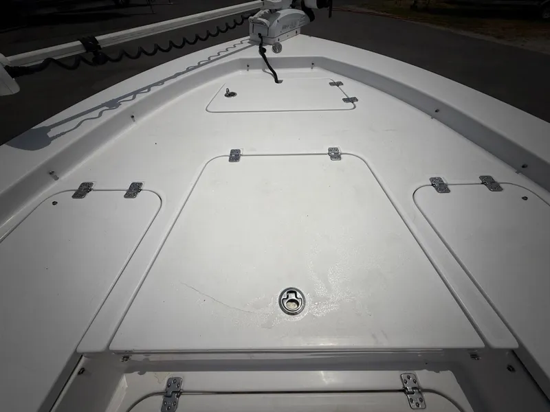 Slide: The Image of 2020 Sportsman Masters 247 Bay Boat deck with storage compartments and trolling motor. - 45