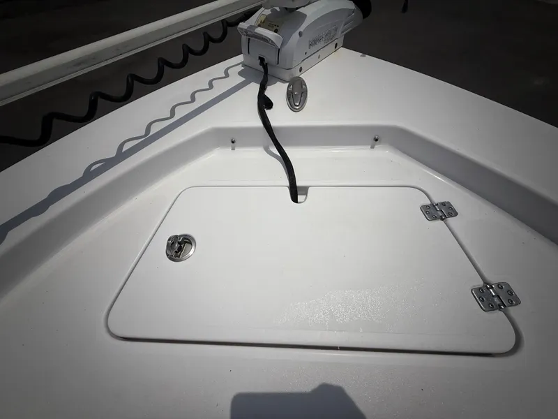 Slide: The Image of 2020 Sportsman Masters 247 Bay Boat deck with storage hatch and trolling motor. - 47