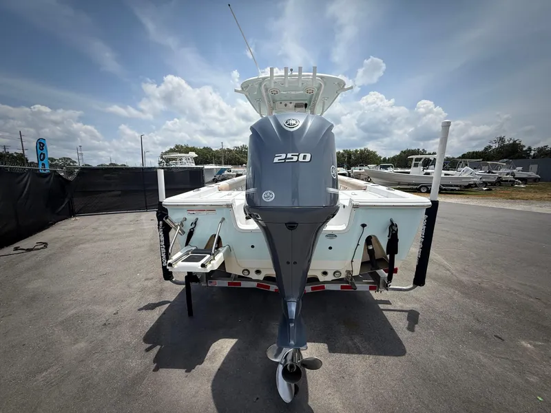 Slide: The Image of 2020 Sportsman Masters 247 Bay Boat with 250 HP engine, parked outdoors. - 7