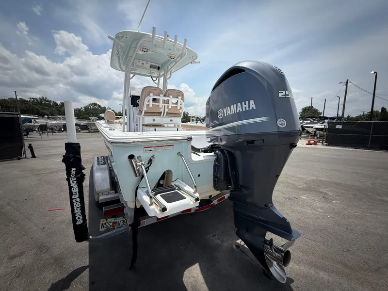 Slide: The Image of 2020 Sportsman Masters 247 Bay Boat with Yamaha 250 engine, parked outdoors. - 8