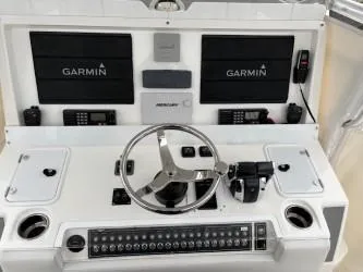 Slide: The Image of Control panel of 2018 Invincible 42 CC boat with Garmin navigation systems. - 8