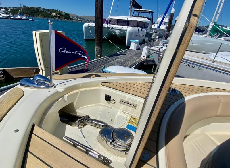 Slide: The Image of 2020 Chris-Craft Calypso 26 boat docked, showcasing deck and seating area. - 15