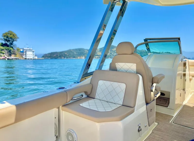 Slide: The Image of 2020 Chris-Craft Calypso 26 boat interior with luxurious seating on a sunny day. - 20