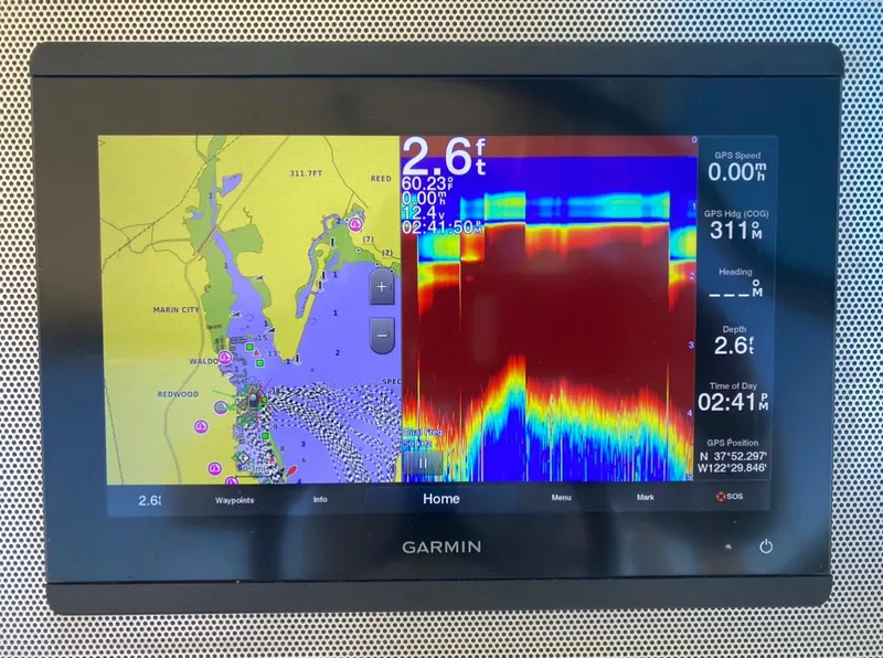 Slide: The Image of Garmin marine display showing navigation and sonar data on a Chris-Craft Calypso 26, 2020 model. - 25