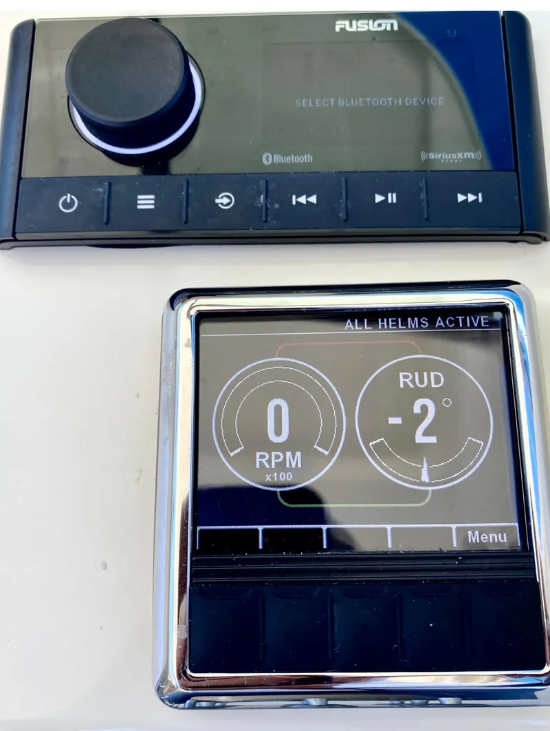 Slide: The Image of Fusion Bluetooth device and control panel on 2020 Chris-Craft Calypso 26 boat. - 27