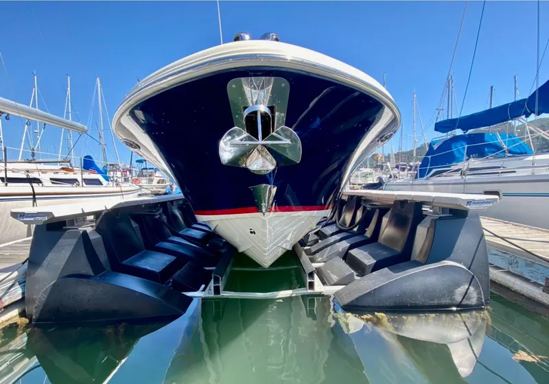 Slide: The Image of 2020 Chris-Craft Calypso 26 boat docked in marina, front view. - 34