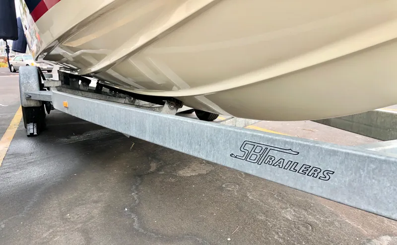 Slide: The Image of 2020 Chris-Craft Calypso 26 boat on SB Trailers trailer. - 40