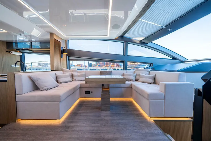 Slide: The Image of Luxurious interior of 2023 Pearl 62 yacht with modern seating and ambient lighting. - 13