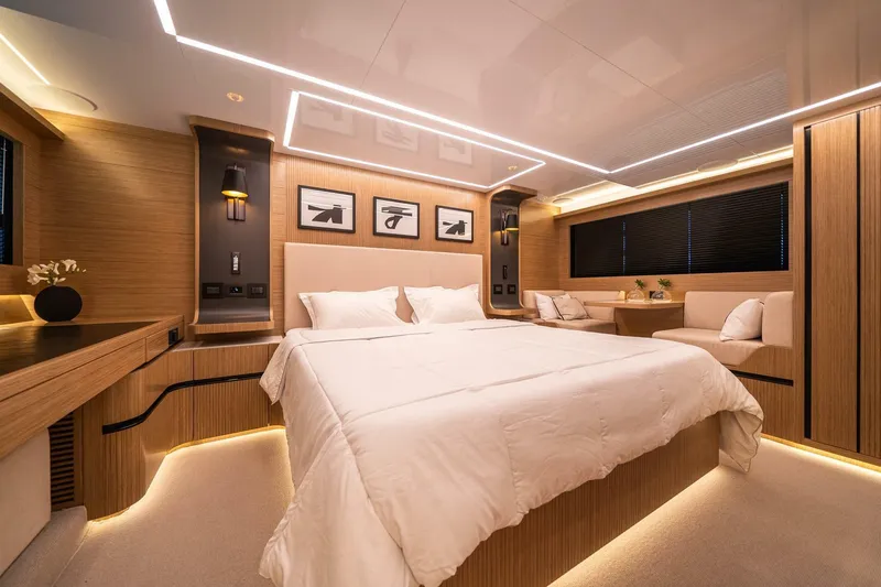 Slide: The Image of Luxurious bedroom interior in 2023 Pearl 62 yacht, featuring modern design and ambient lighting. - 16