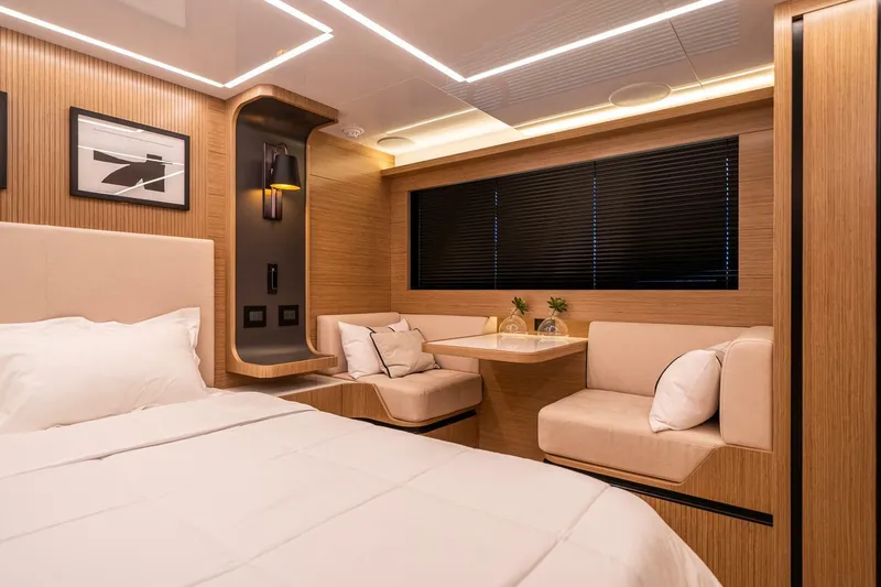 Slide: The Image of Luxurious interior of 2023 Pearl 62 yacht with modern design and cozy seating area. - 18