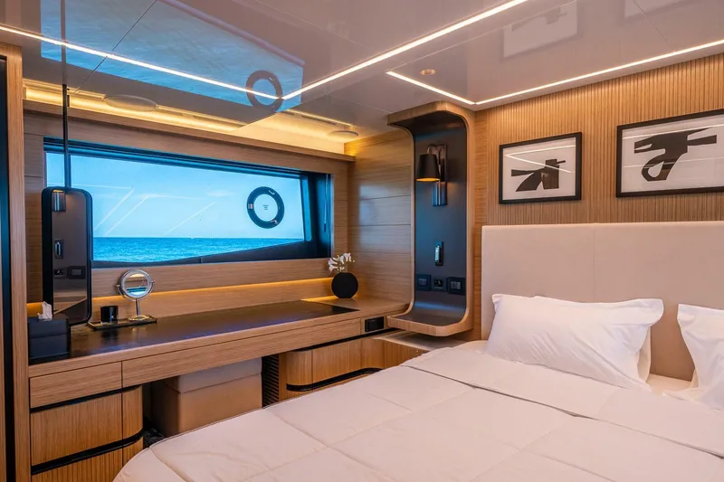 Slide: The Image of Luxurious bedroom interior on 2023 Pearl 62 yacht with ocean view and modern decor. - 20