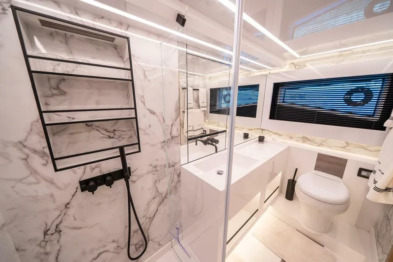 Slide: The Image of Luxurious bathroom in 2023 Pearl 62 yacht with marble walls and modern fixtures. - 23