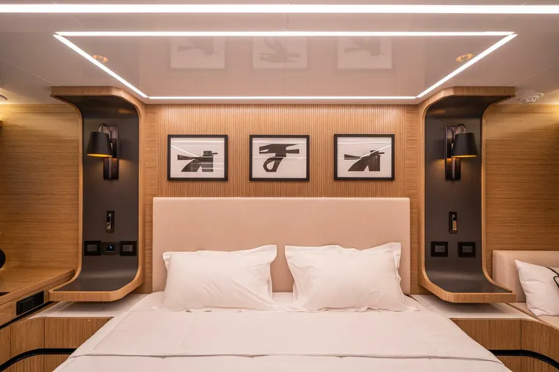Slide: The Image of Luxurious bedroom interior on 2023 Pearl 62 yacht, featuring modern design and elegant lighting. - 24