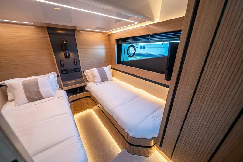 Slide: The Image of Luxurious cabin interior of 2023 Pearl 62 yacht with twin beds and modern design. - 30