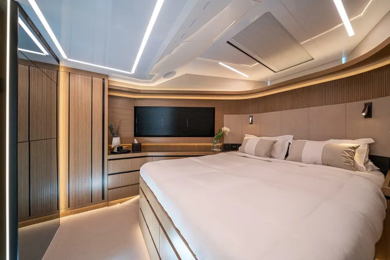 Slide: The Image of Luxurious bedroom interior of 2023 Pearl 62 yacht, featuring modern design and ambient lighting. - 33