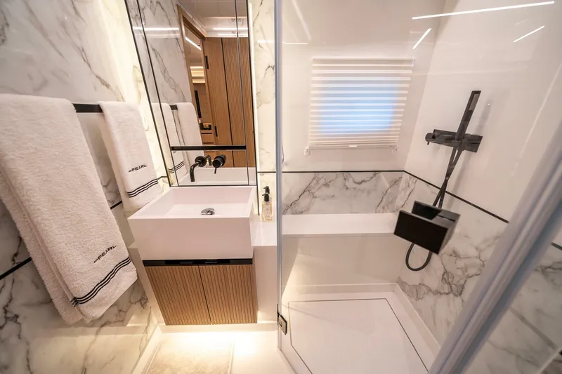 Slide: The Image of Luxurious bathroom in 2023 Pearl 62 yacht with marble walls and modern fixtures. - 35