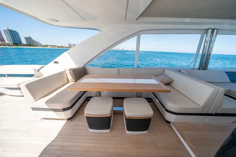 Slide: The Image of Luxurious Pearl 62 yacht interior with elegant seating and ocean view, 2023 model. - 38