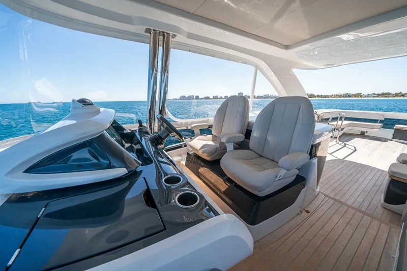 Slide: The Image of Luxurious 2023 Pearl 62 yacht interior with ocean view and modern seating. - 43