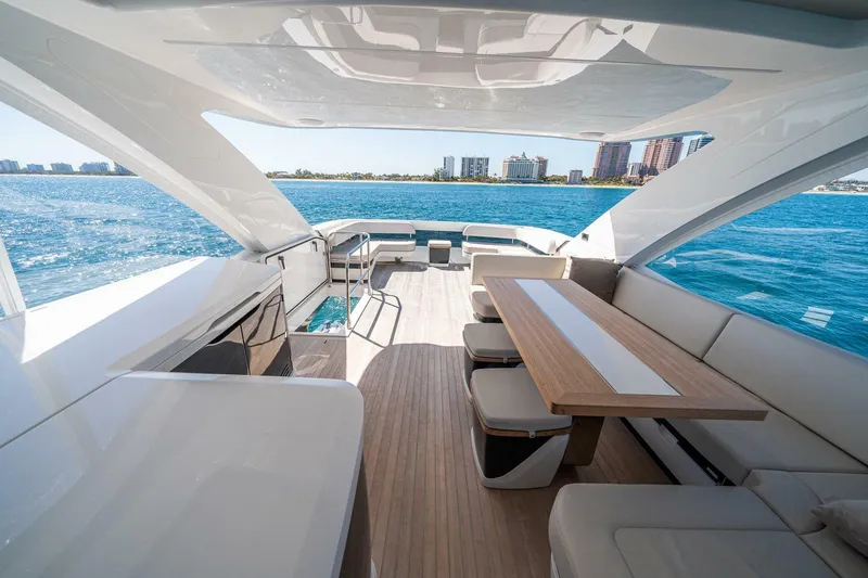 Slide: The Image of Luxurious 2023 Pearl 62 yacht interior with ocean view and modern seating area. - 45