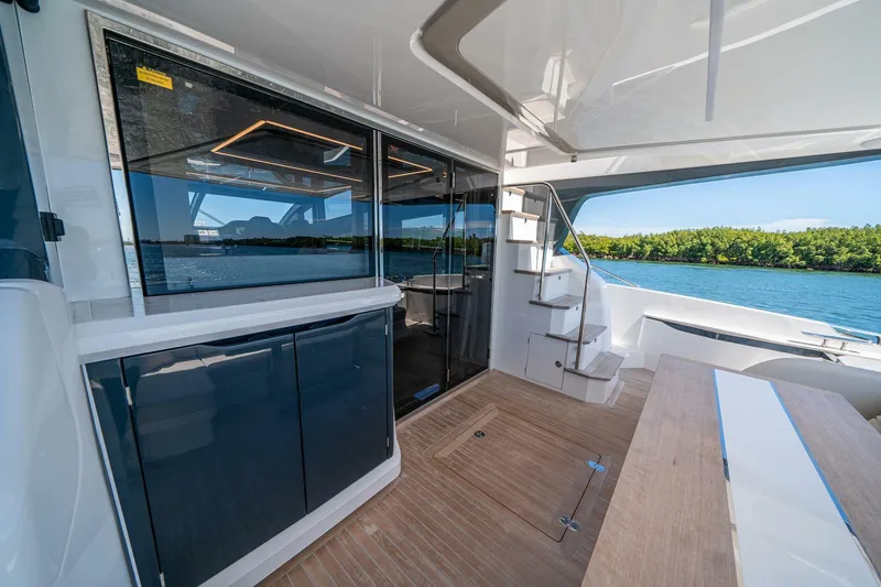 Slide: The Image of Luxurious Pearl 62 yacht interior, featuring sleek design and scenic water views, 2023 model. - 49