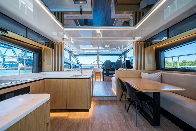 Slide: The Image of Luxurious interior of 2023 Pearl 62 yacht with modern kitchen and dining area. - 7