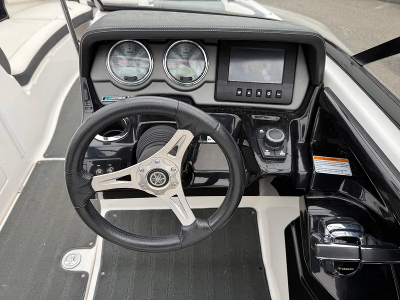 Slide: The Image of Steering wheel and dashboard of 2016 Yamaha Boats 242 Limited S E-Series. - 12
