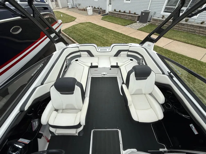 Slide: The Image of 2016 Yamaha Boats 242 Limited S E-Series interior with white seating and sleek design. - 13