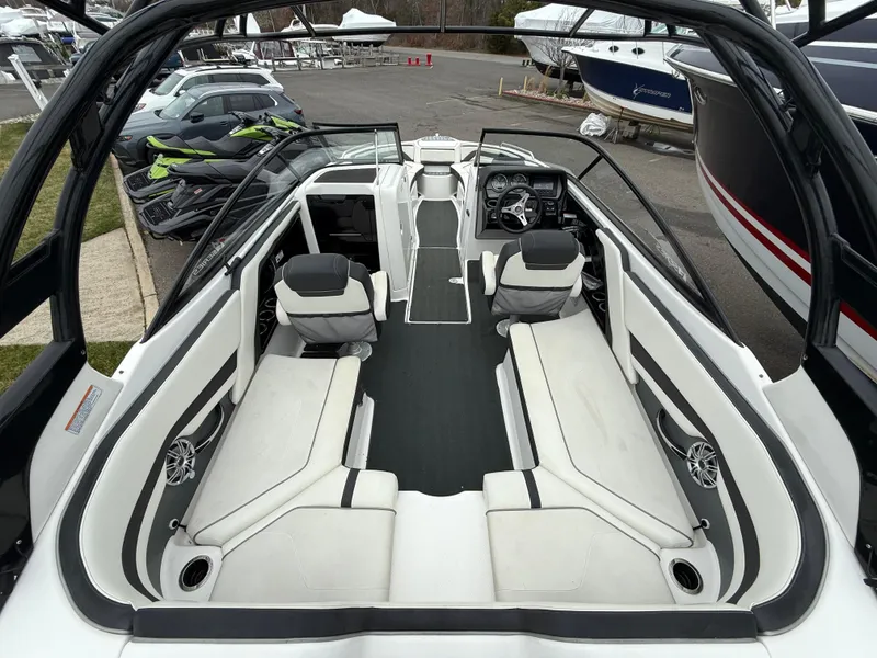 Slide: The Image of 2016 Yamaha Boats 242 Limited S E-Series interior with spacious seating and sleek design. - 14