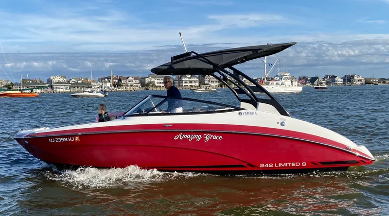 Slide: The Image of 2016 Yamaha 242 Limited S E-Series boat cruising on a sunny day. - 4
