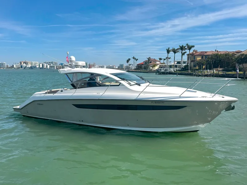 Slide: The Image of 2015 Pursuit SC 365i Sport Coupe cruising on a sunny day in coastal waters. - 0