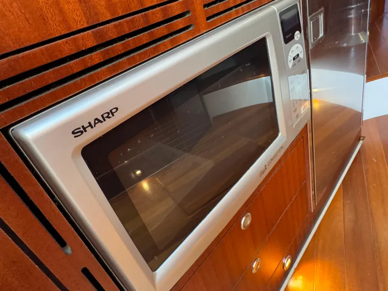 Slide: The Image of Sharp microwave in 2015 Pursuit SC 365i Sport Coupe kitchen area. - 17