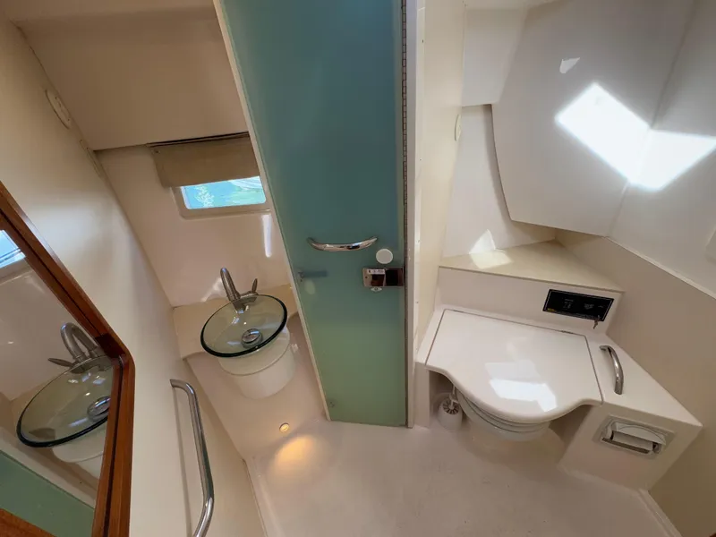 Slide: The Image of 2015 Pursuit SC 365i Sport Coupe bathroom with modern fixtures and frosted glass door. - 19