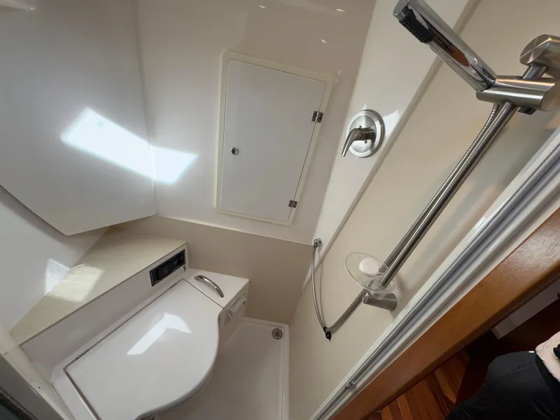 Slide: The Image of 2015 Pursuit SC 365i Sport Coupe bathroom with shower and toilet. - 21