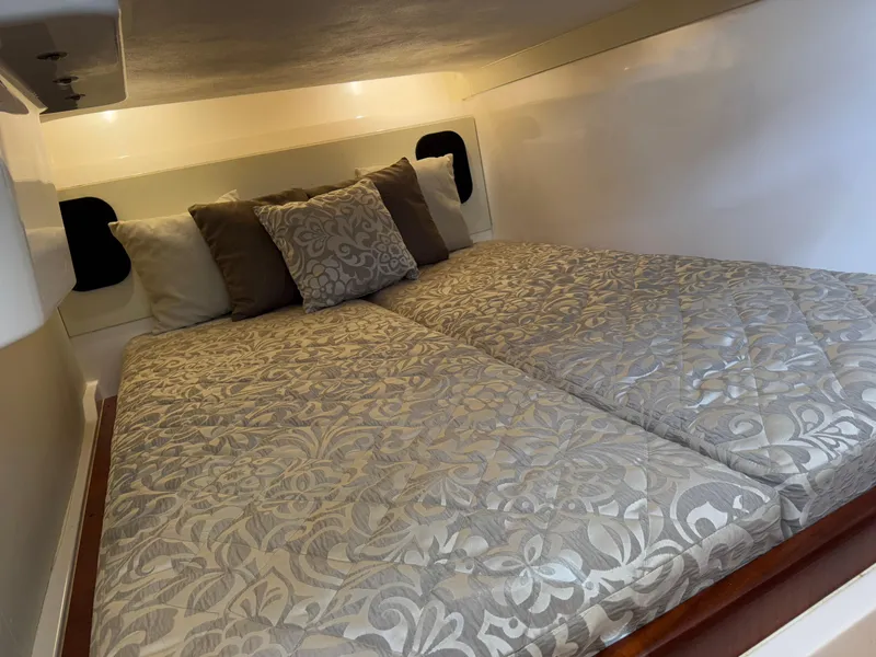 Slide: The Image of Luxurious cabin interior of 2015 Pursuit SC 365i Sport Coupe with elegant bedding. - 23