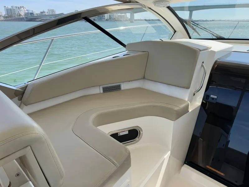Slide: The Image of Interior of 2015 Pursuit SC 365i Sport Coupe with beige seating and ocean view. - 30