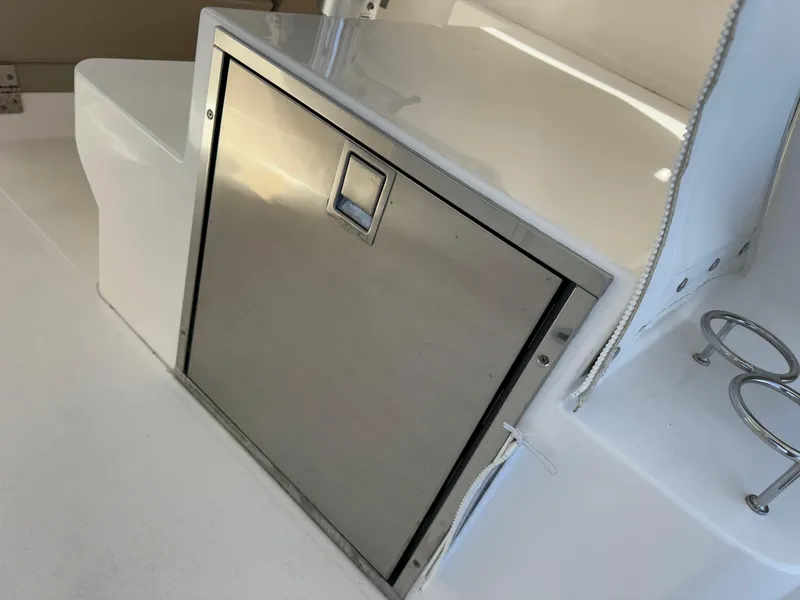 Slide: The Image of Stainless steel compartment on 2015 Pursuit SC 365i Sport Coupe boat. - 33