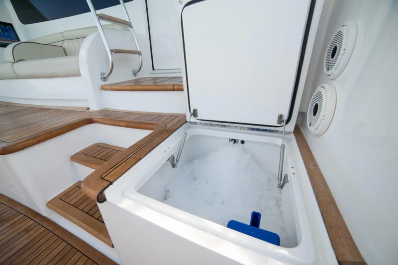 Slide: The Image of Ice storage compartment on 2019 Viking 72 Enclosed Bridge yacht deck. - 24