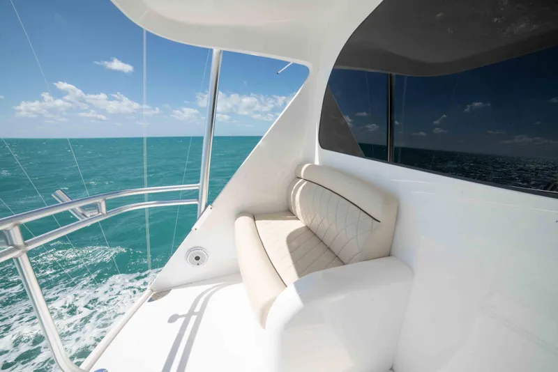 Slide: The Image of 2019 Viking 72 Enclosed Bridge yacht with ocean view and comfortable seating. - 29