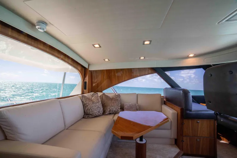 Slide: The Image of Luxurious interior of 2019 Viking 72 Enclosed Bridge yacht with ocean view. - 39