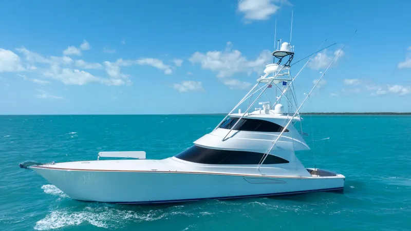 Slide: The Image of 2019 Viking 72 Enclosed Bridge yacht cruising on turquoise ocean waters. - 4