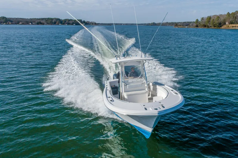 Slide: The Image of 2005 Buddy Davis 28 boat cruising on water. - 12