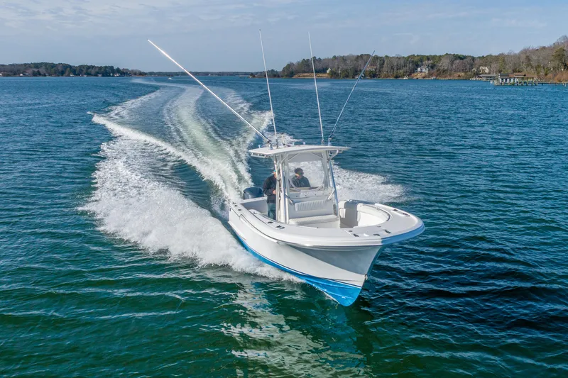 Slide: The Image of 2005 Buddy Davis 28 boat cruising on the water at full speed. - 14