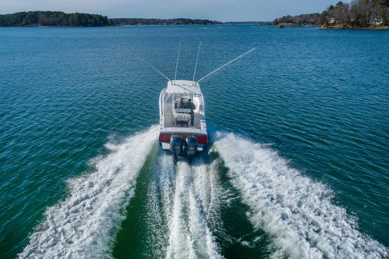 Slide: The Image of 2005 Buddy Davis 28 boat cruising on open water. - 3