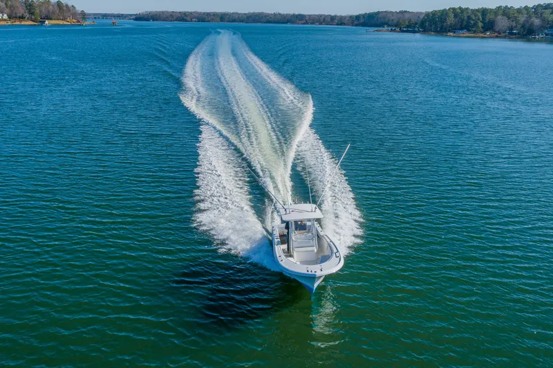 Slide: The Image of 2005 Buddy Davis 28 boat cruising on open water. - 7