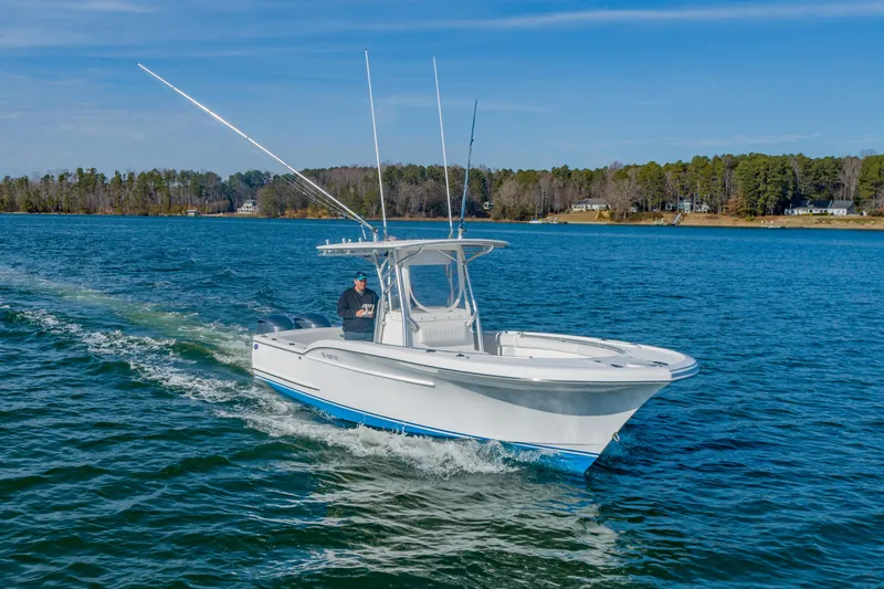 Slide: The Image of 2005 Buddy Davis 28 boat cruising on calm waters. - 9