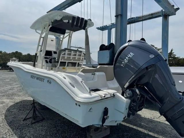 Slide: The Image of 2025 Key West 239FS boat with Yamaha engine on a lift, ready for launch. - 3