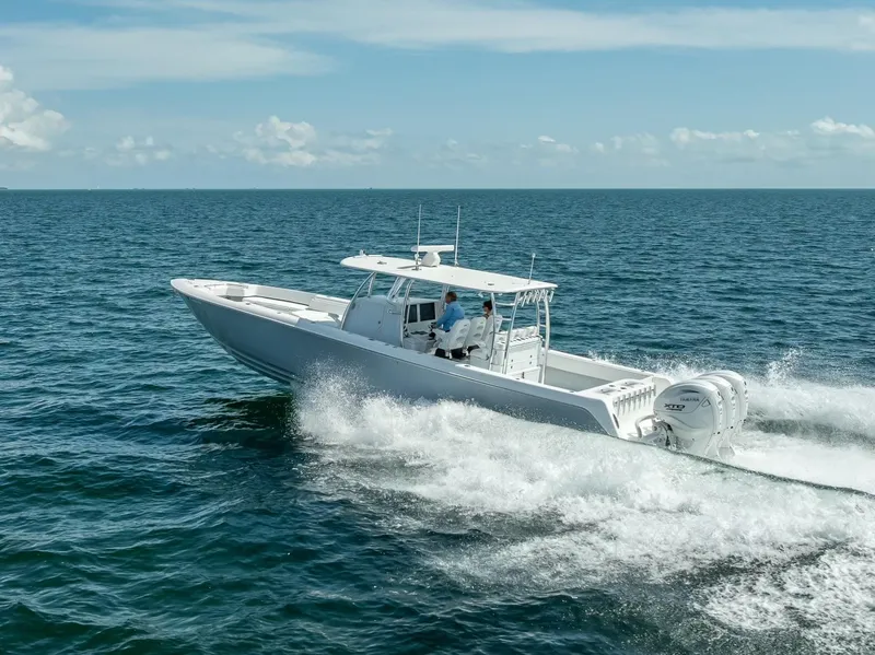 Slide: The Image of 2025 Contender 44 ST boat cruising on open ocean waters. - 29