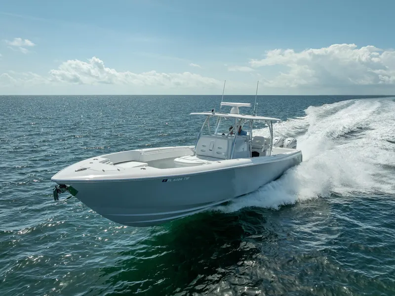 Slide: The Image of 2025 Contender 44 ST boat cruising on open ocean waters. - 31